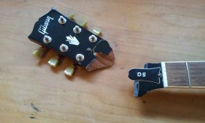 A repair job I often perform: Gluing broken headstocks. Usually, the head is still hanging on to the neck, here it came off.